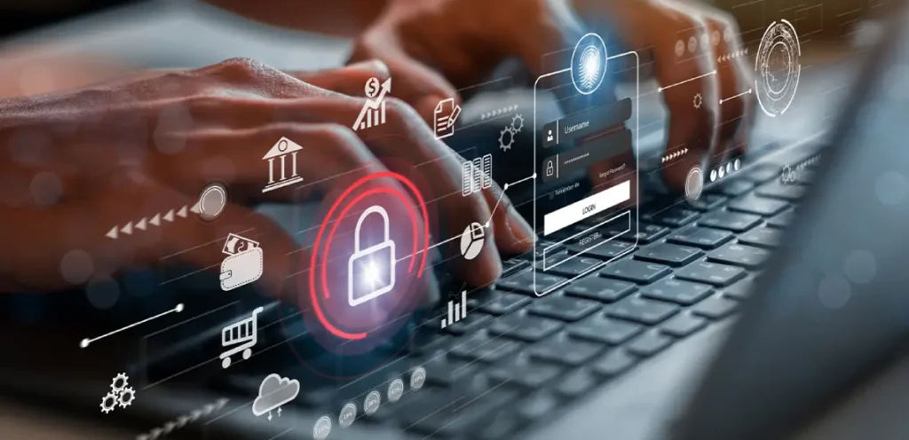 Ręce na klawiaturze laptopa z wirtualnymi ikonami cyberbezpieczeństwa i ochrony danych